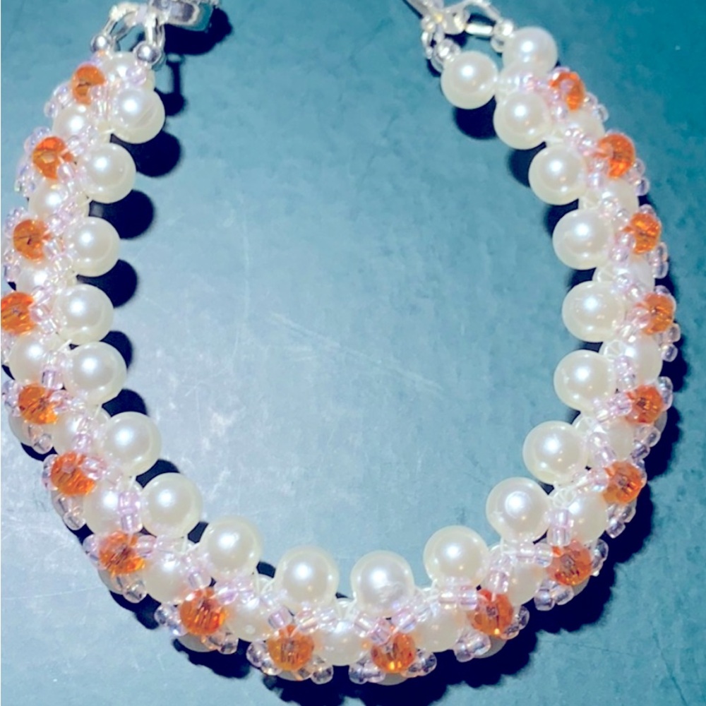 Hand crafted faux pearls is 7 1/2 length with sterling silver clasp No tag